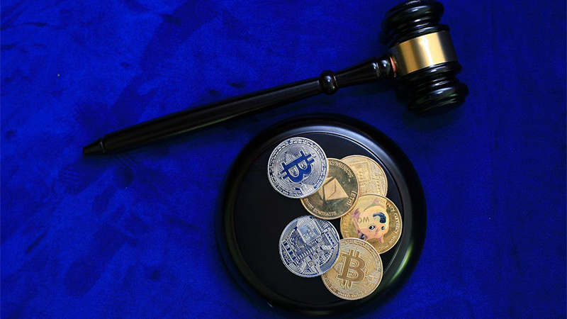 image featuring a gavel and some digital coins