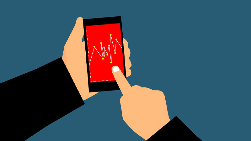image of a person trading on a mobile device.
